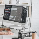 side-view-of-attractive-art-editor-working-near-co-2022-12-16-17-23-15-utc